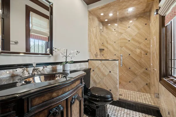 a spacious bathroom with a double vanity sink and a mirror