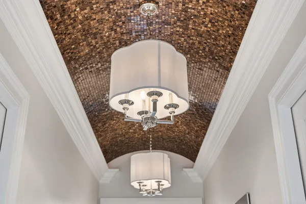 a large bedroom with a bed and a cabinets