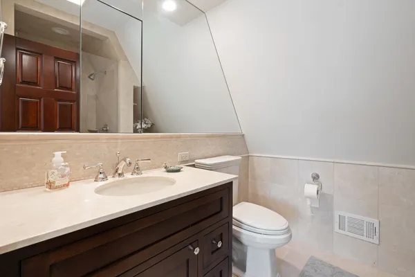a view of hallway with stairs and a window