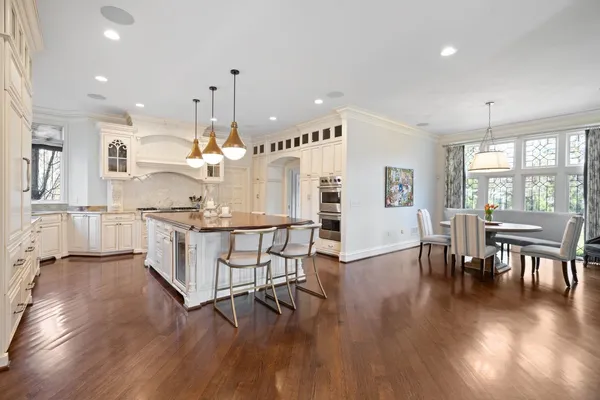 a living room with furniture and large windows