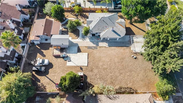 an aerial view of residential houses with outdoor space