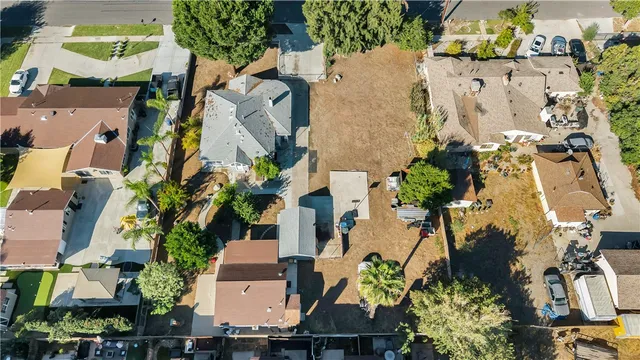 an aerial view of multiple houses with yard