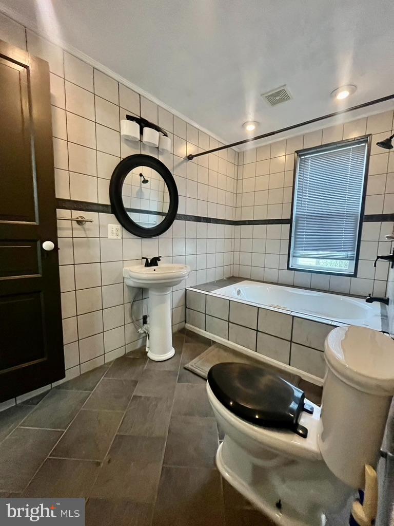 1420 Main Street Port Trevorton, PA 17864 - Photo 13 of 19 a bathroom with a toilet a sink and a mirror