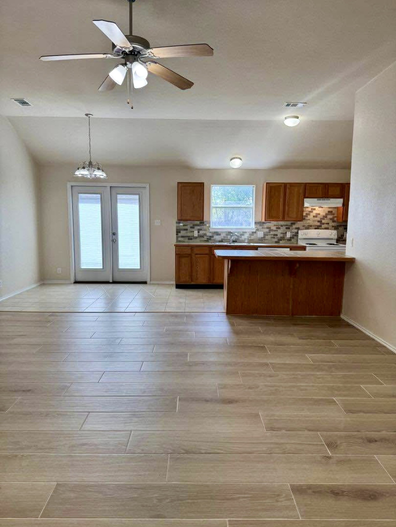 400 Blue Shale Drive Jarrell, TX 76537 - Photo 13 of 22 a view of kitchen and kitchen with microwave
