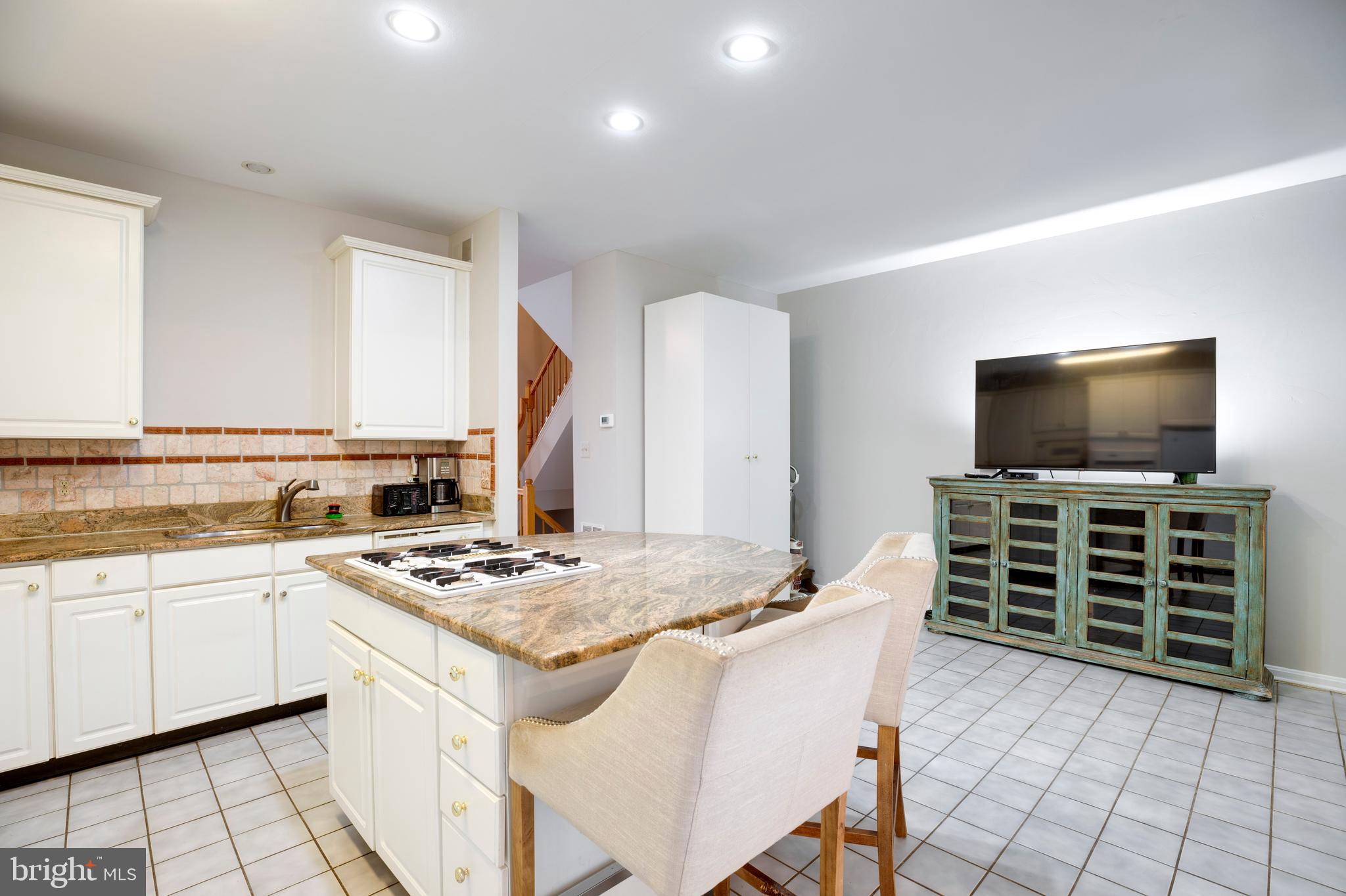 5909 Rinard Drive Centreville, VA 20120 - Photo 14 of 46 a kitchen with stainless steel appliances a stove top oven refrigerator and a sink