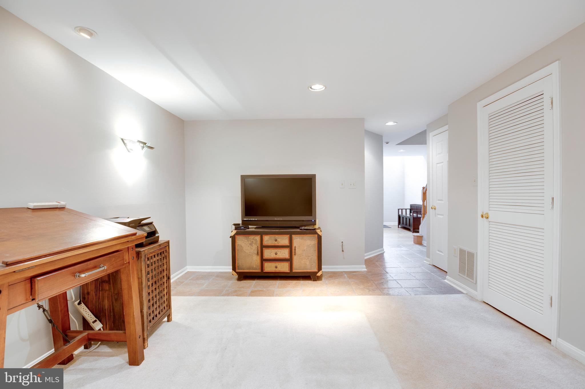 5909 Rinard Drive Centreville, VA 20120 - Photo 21 of 46 a living room with furniture and a flat screen tv