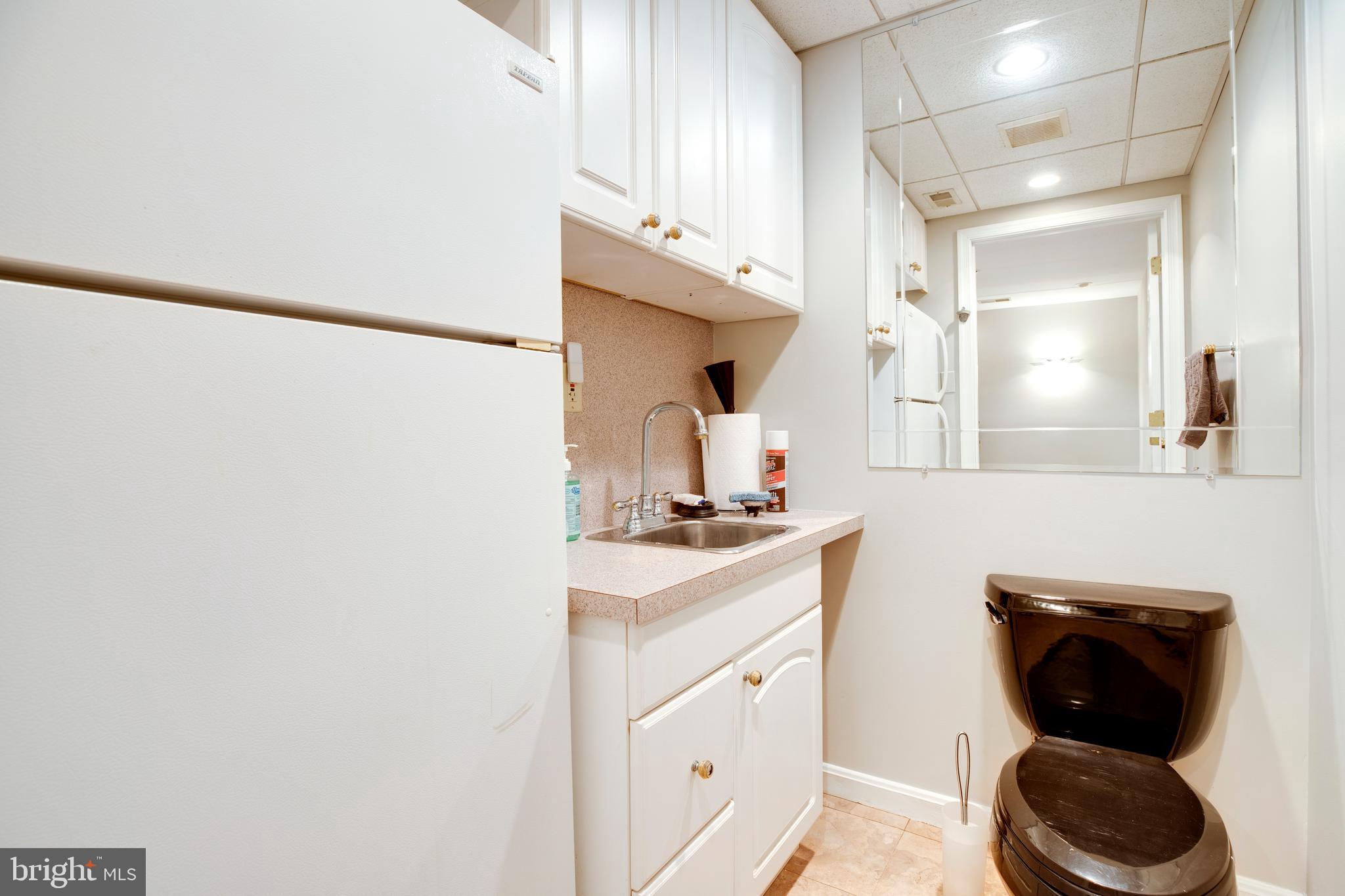5909 Rinard Drive Centreville, VA 20120 - Photo 23 of 46 a kitchen with a sink and a stove