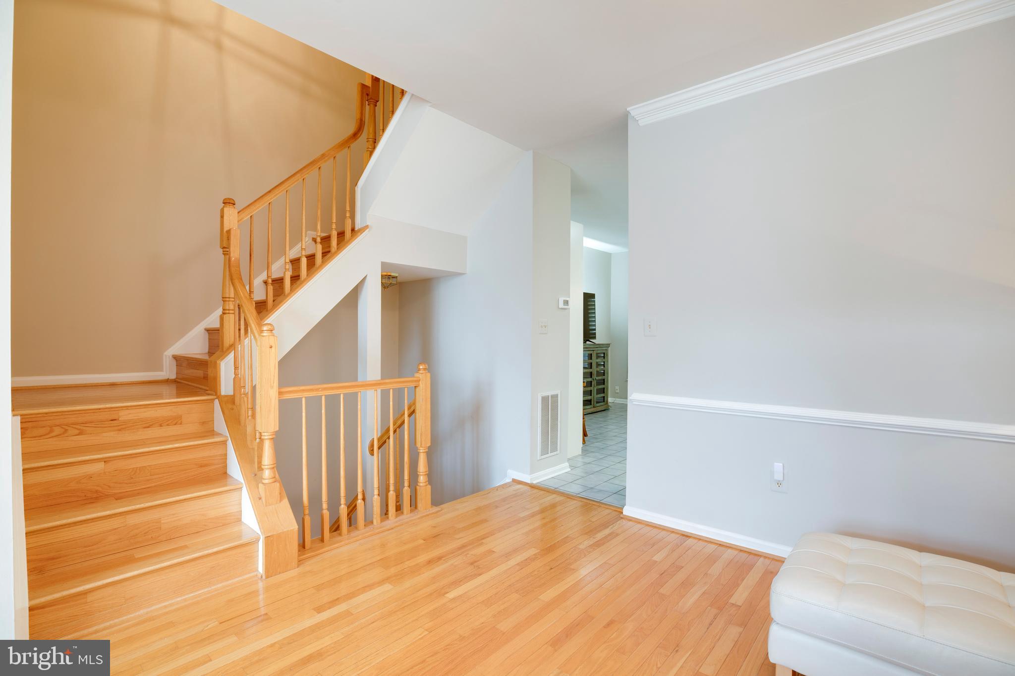 5909 Rinard Drive Centreville, VA 20120 - Photo 26 of 46 a view of a bedroom with wooden floor and stairs
