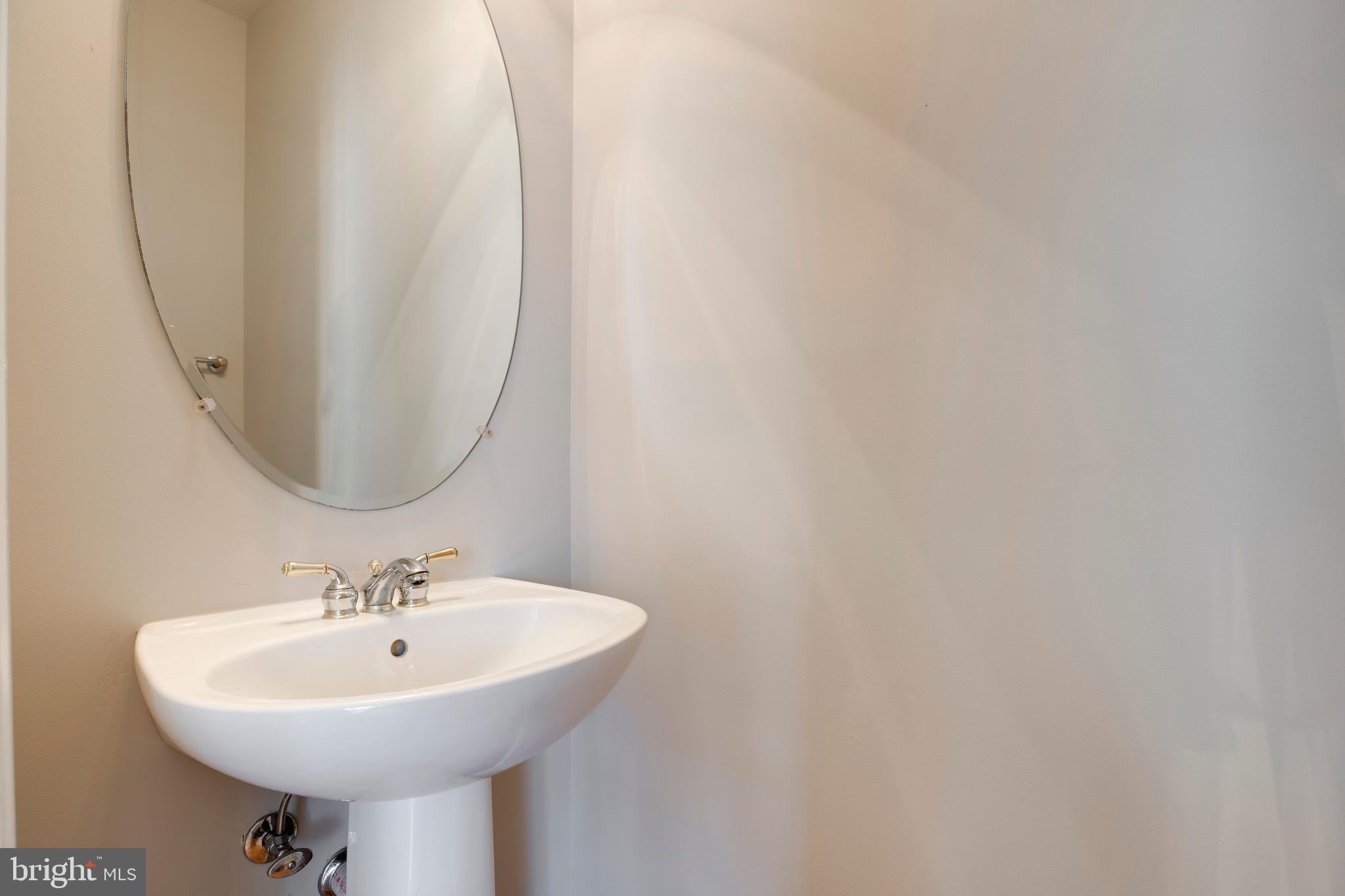 5909 Rinard Drive Centreville, VA 20120 - Photo 27 of 46 a white sink sitting next to a white sink