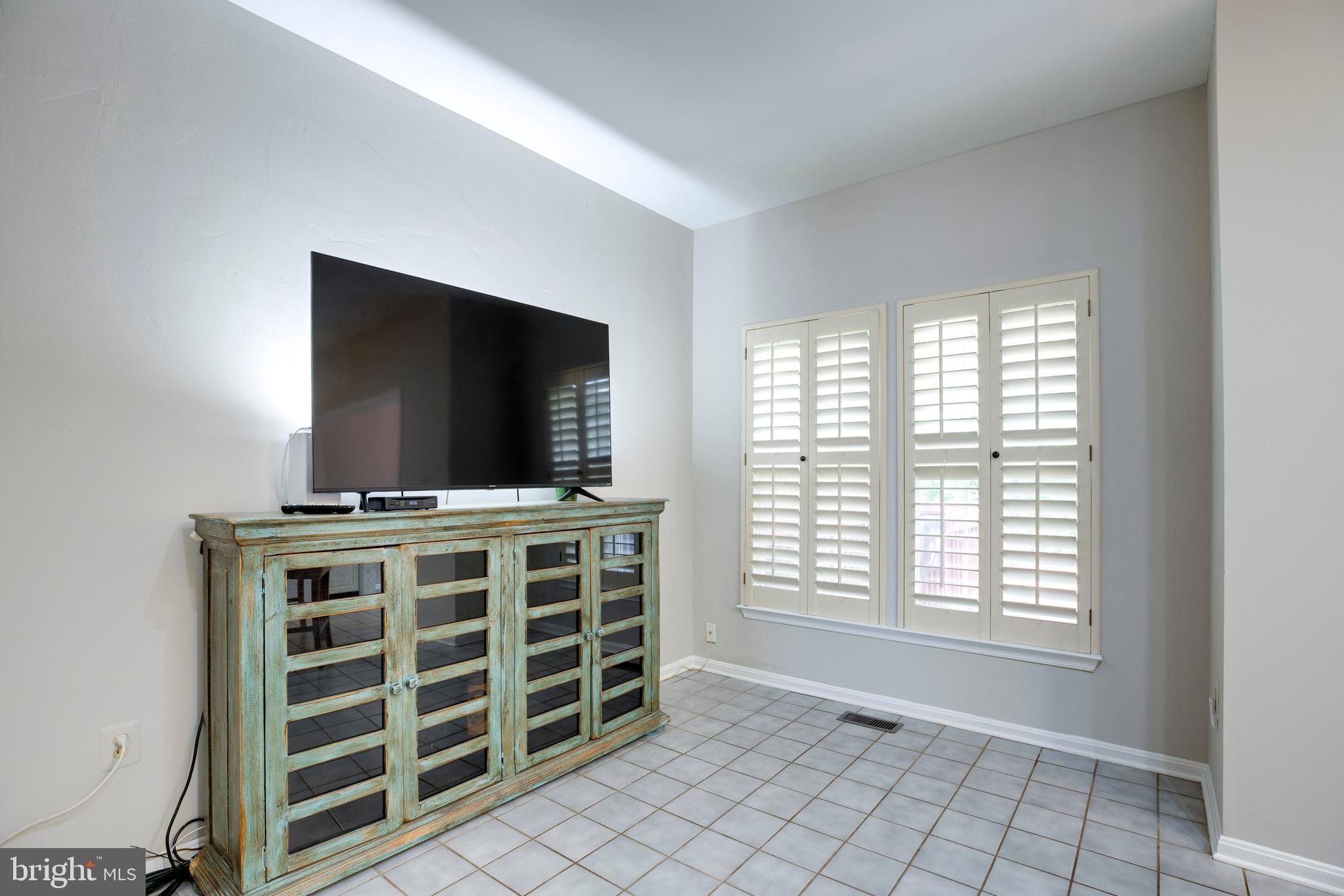 5909 Rinard Drive Centreville, VA 20120 - Photo 28 of 46 a living room with furniture and a flat screen tv