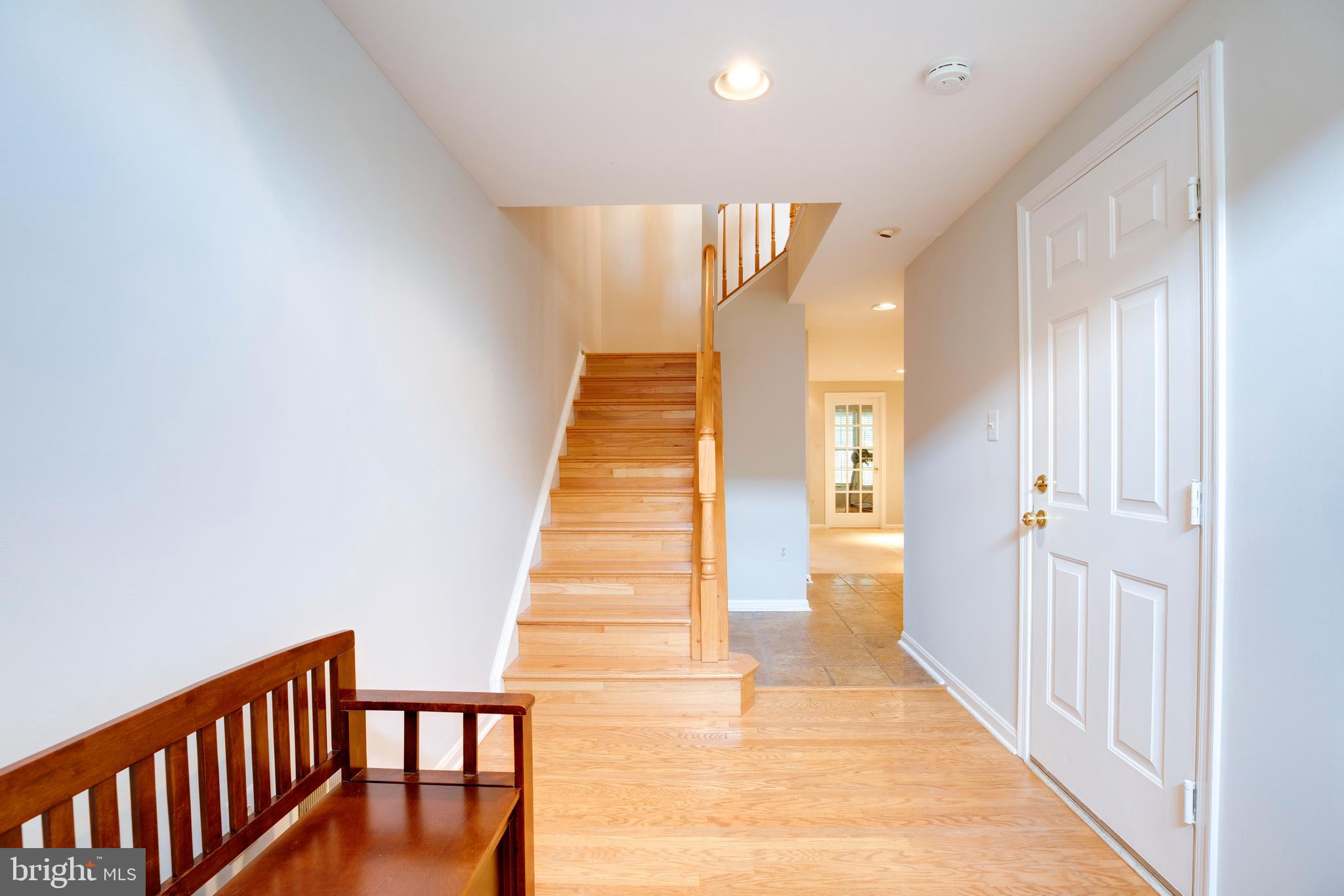 5909 Rinard Drive Centreville, VA 20120 - Photo 3 of 46 a view of a hallway with wooden floor and staircase