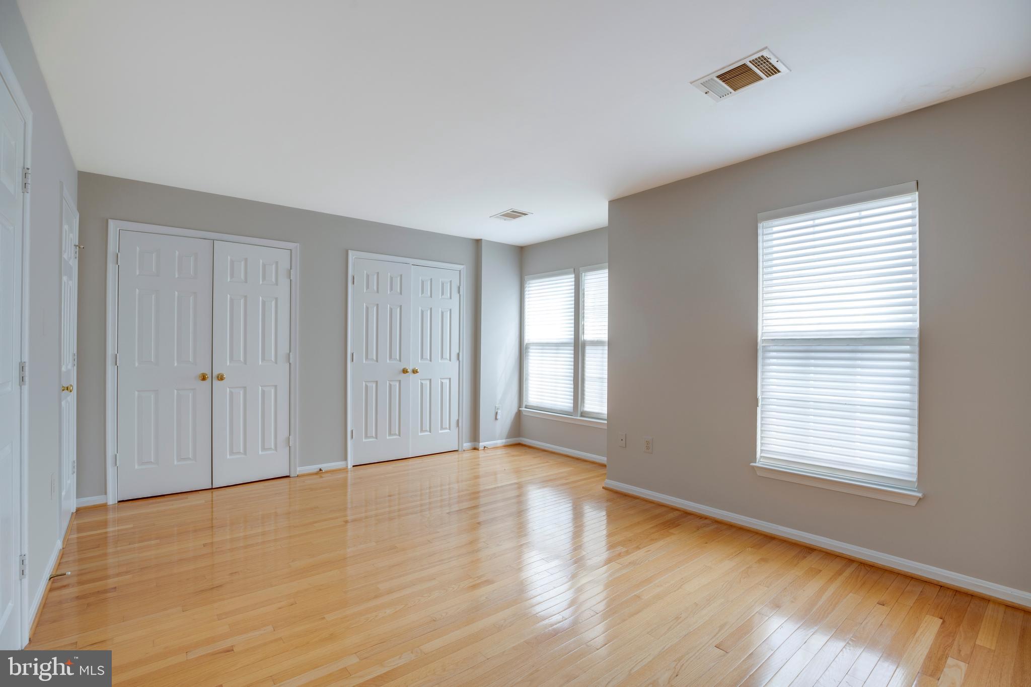 5909 Rinard Drive Centreville, VA 20120 - Photo 31 of 46 a view of an empty room with wooden floor and a window
