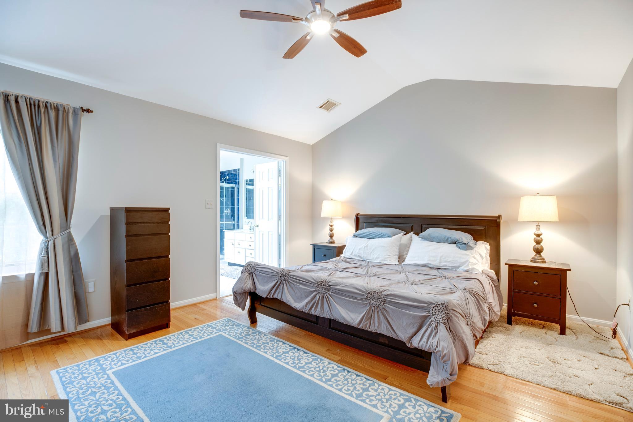 5909 Rinard Drive Centreville, VA 20120 - Photo 34 of 46 a bedroom with a bed and a walk in closet