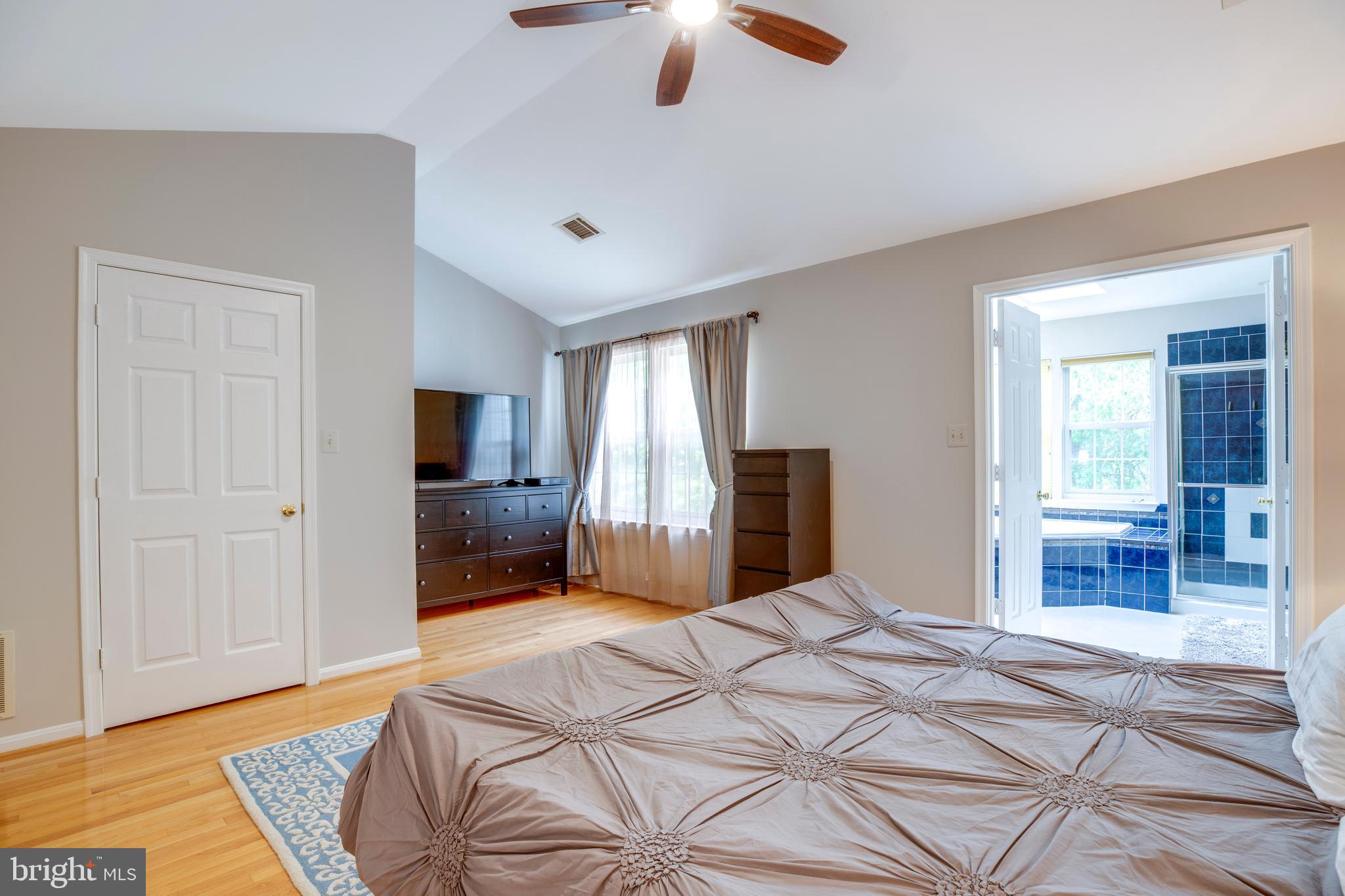 5909 Rinard Drive Centreville, VA 20120 - Photo 35 of 46 a bedroom with a bed and a chandelier
