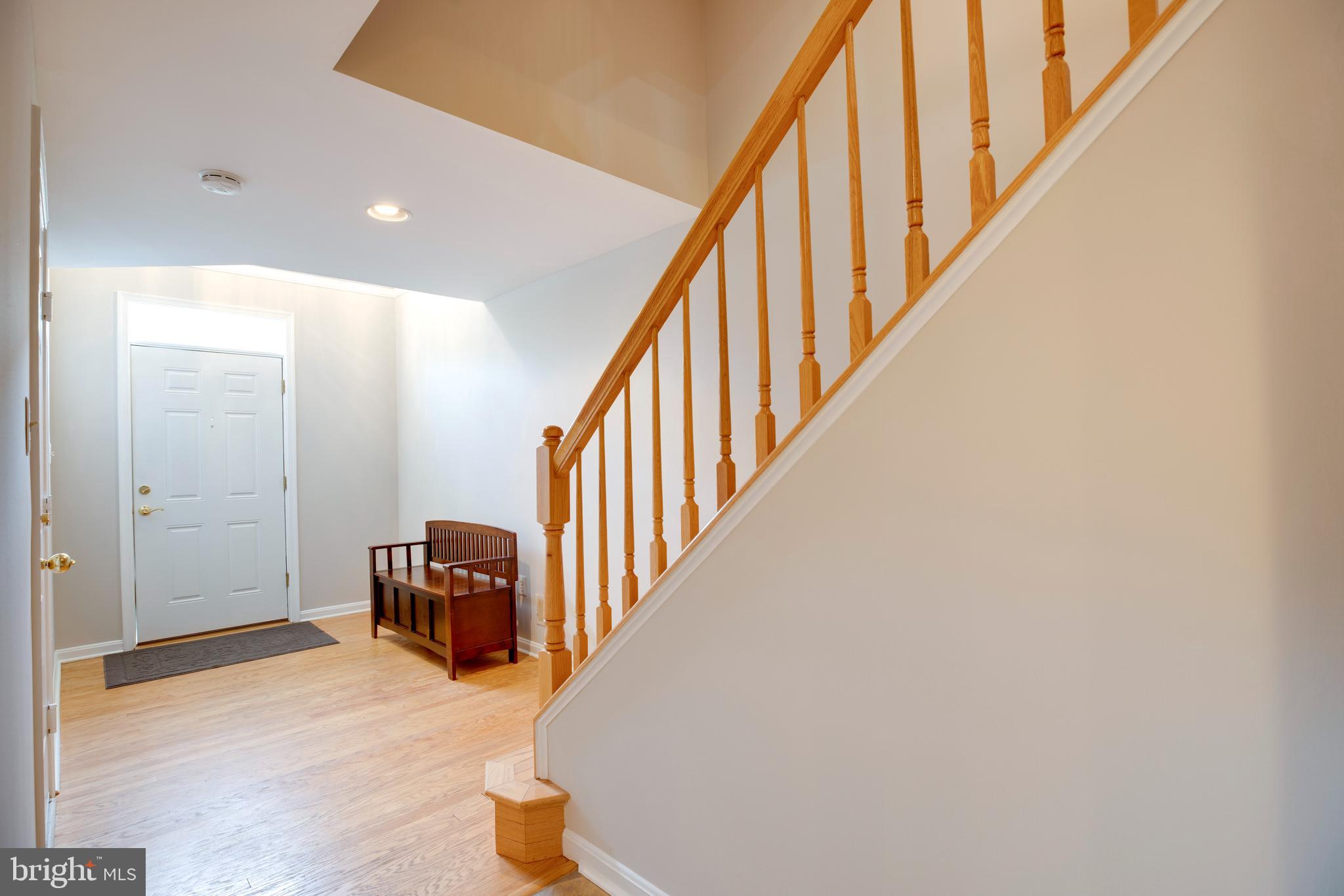 5909 Rinard Drive Centreville, VA 20120 - Photo 4 of 46 a view of entryway and hall with wooden floor