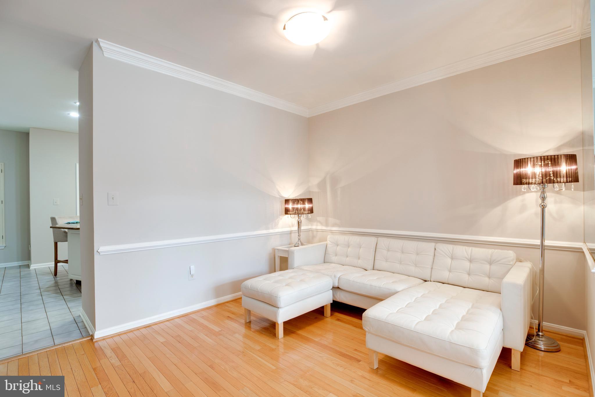 5909 Rinard Drive Centreville, VA 20120 - Photo 6 of 46 a living room with furniture and a table
