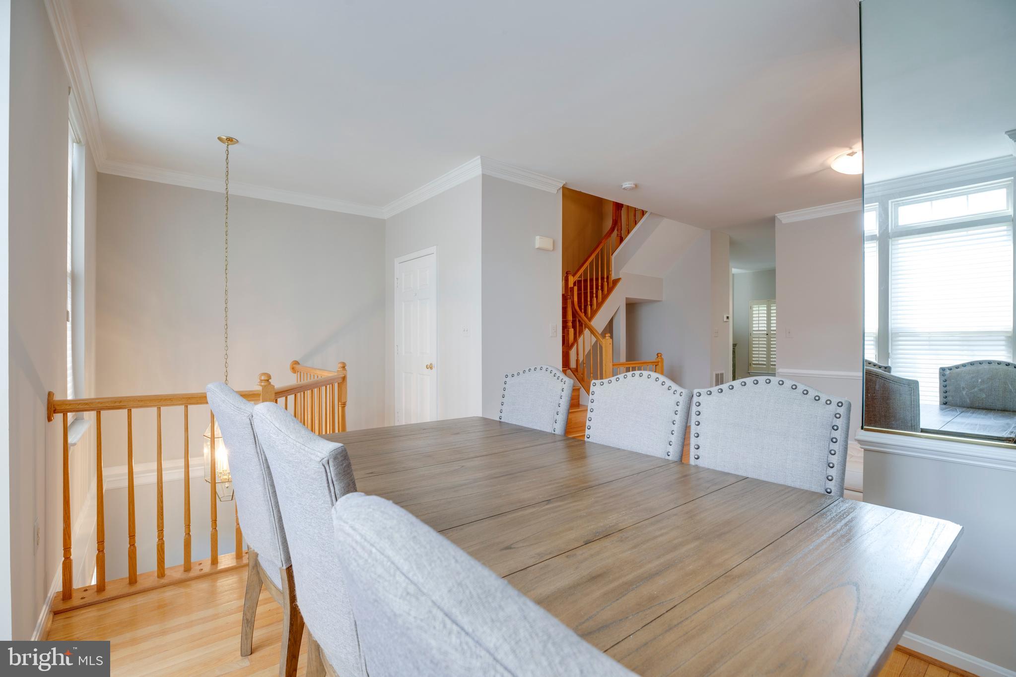 5909 Rinard Drive Centreville, VA 20120 - Photo 8 of 46 a workspace with furniture and wooden floor