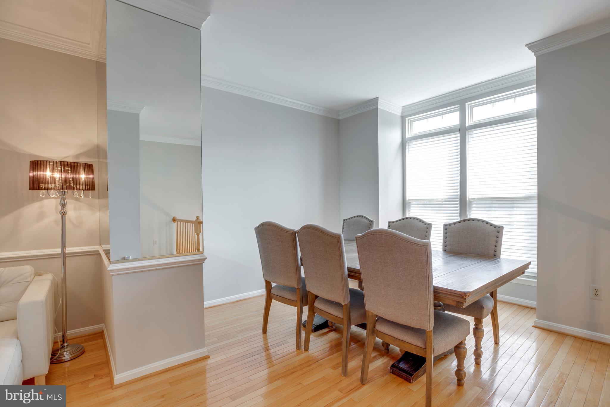 5909 Rinard Drive Centreville, VA 20120 - Photo 9 of 46 a view of a dining room with furniture and wooden floor