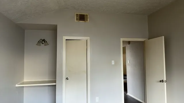 a bathroom with a glass shower door