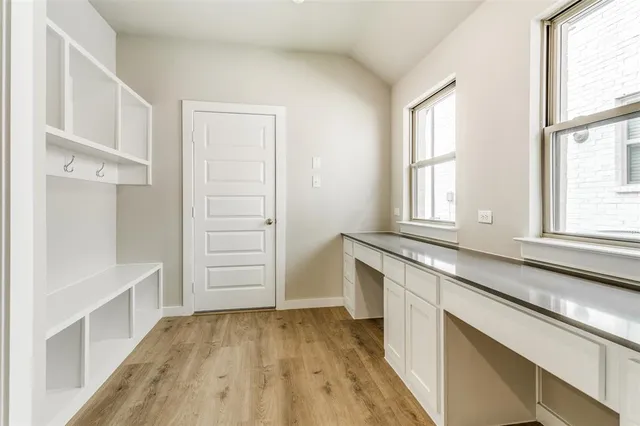 a view of a kitchen cabinets and a window