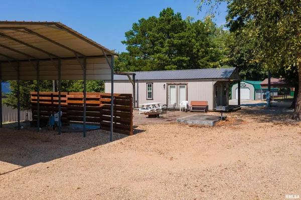 a view of a house with a yard and garage