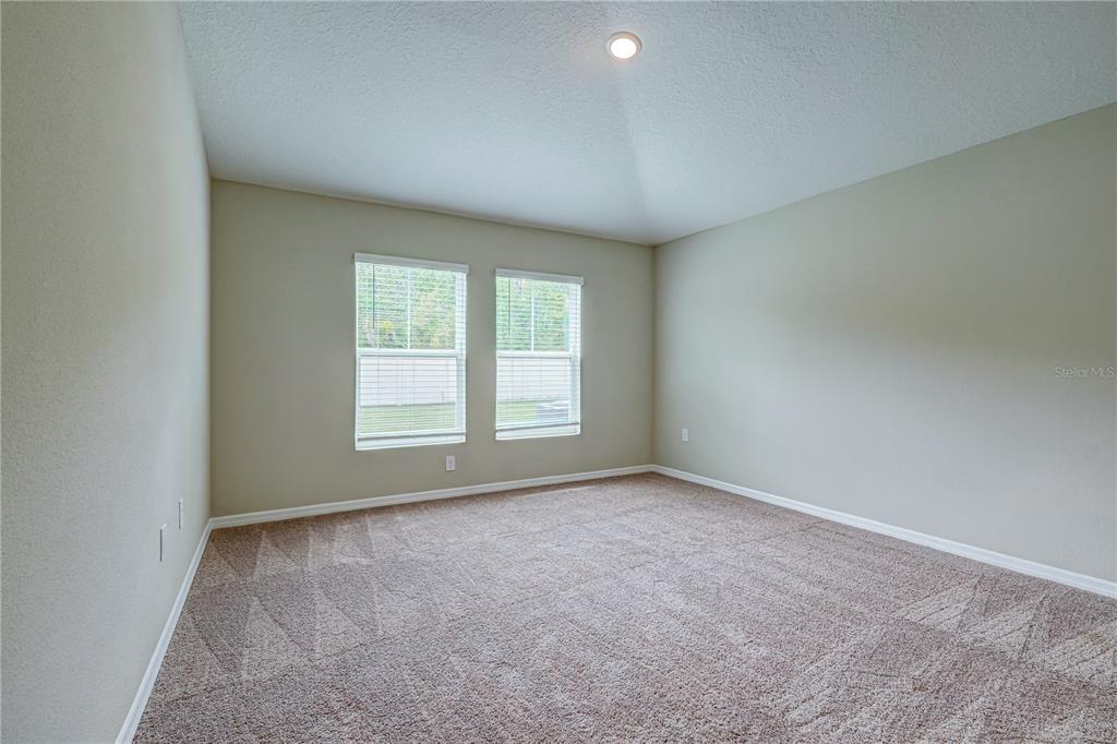 12730 Hysmith Loop Parrish, FL 34219 - Photo 12 of 33 an empty room with a window
