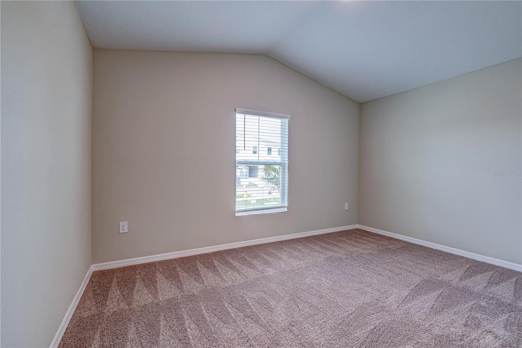 12730 Hysmith Loop Parrish, FL 34219 - Photo 20 of 33 a view of an empty room with a window