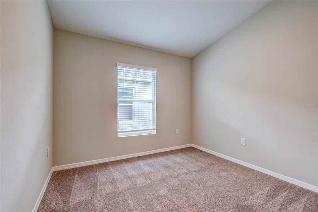 12730 Hysmith Loop Parrish, FL 34219 - Photo 22 of 33 an empty room with a window
