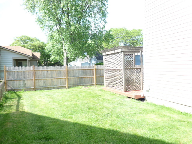 1812 77th Street Naperville, IL 60565 - Photo 17 of 17 a view of a backyard with a small cabin
