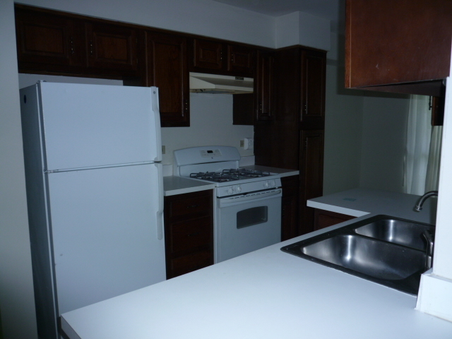 1812 77th Street Naperville, IL 60565 - Photo 5 of 17 a kitchen with stainless steel appliances a refrigerator and a stove