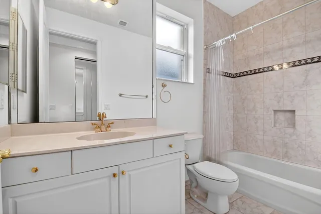 a view of a house with swimming pool and sitting area