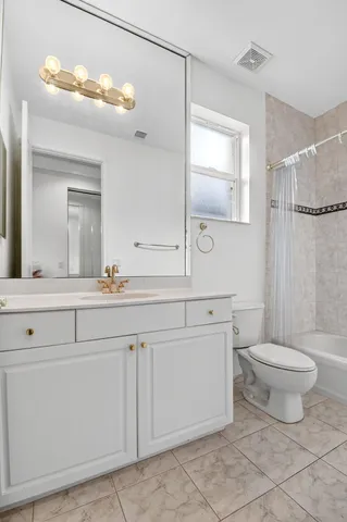 an aerial view of residential houses with outdoor space and street view