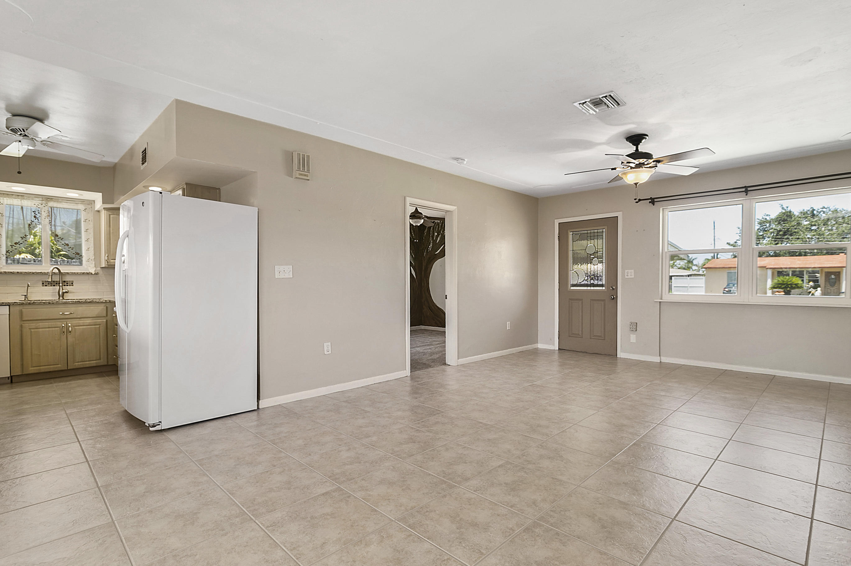 353 Shady Lane Road Palm Springs, FL 33461 - Photo 14 of 30 a view of an empty room with a window