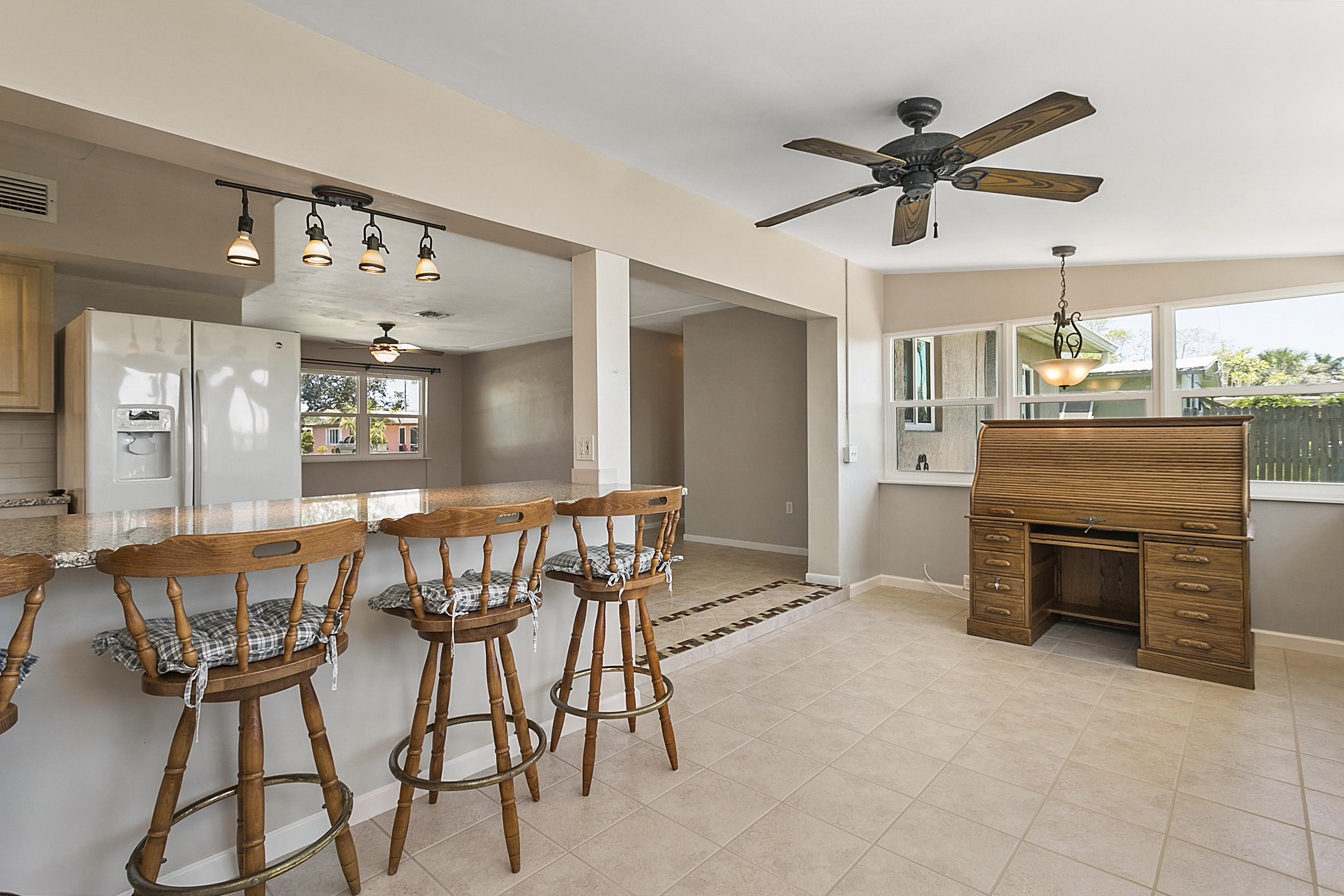 353 Shady Lane Road Palm Springs, FL 33461 - Photo 15 of 30 a view of a dining room kitchen and a window