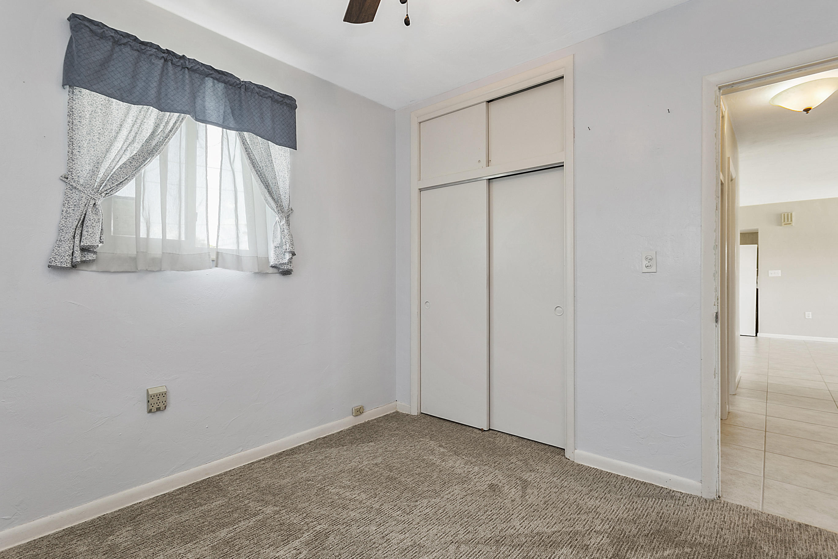 353 Shady Lane Road Palm Springs, FL 33461 - Photo 24 of 30 a view of an empty room with a window