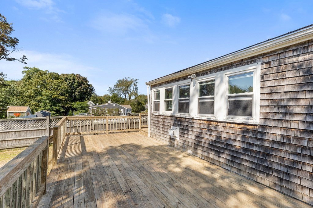 159 Arnold Road Marshfield, MA 02050 - Photo 16 of 22 a view of a balcony with wooden floor and fence