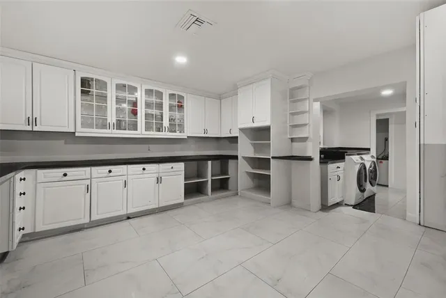 a bed room with a bed window and book shelf