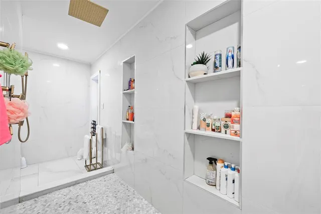 an aerial view of a house with pool porch and furniture