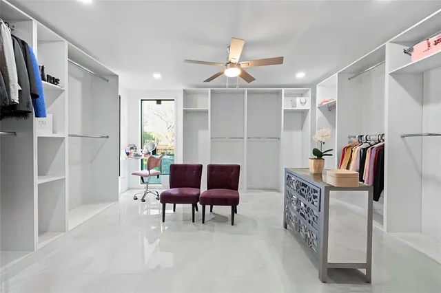 a view of swimming pool in front of residential houses with outdoor space