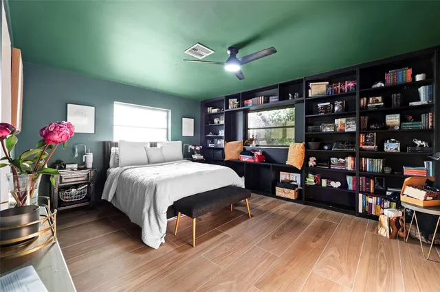 a view of a house with a yard and a garden