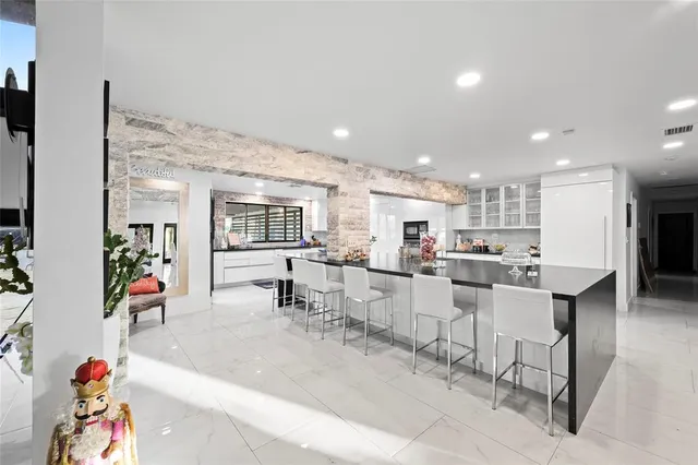 a kitchen with stainless steel appliances granite countertop a stove and a refrigerator