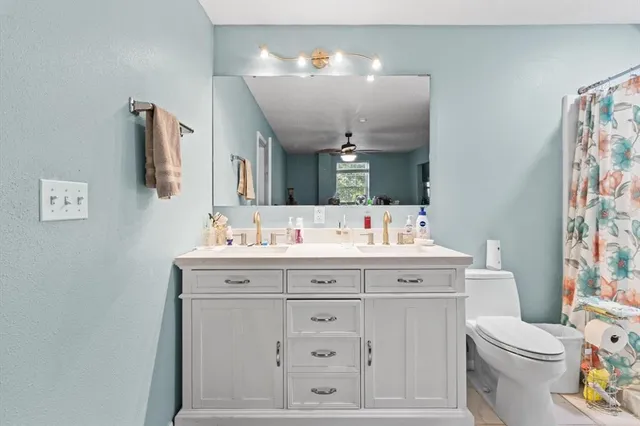 a bathroom with a toilet and a sink