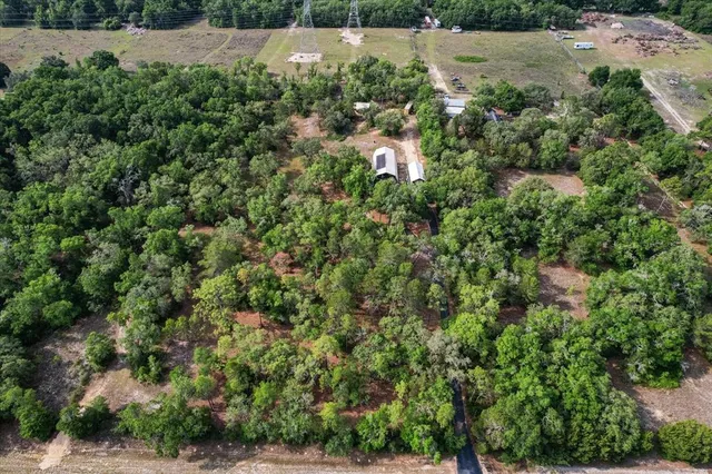 an aerial view of a yard with houses