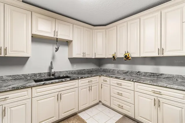 a kitchen with a stove and a microwave