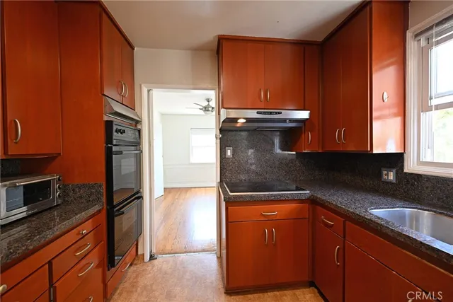 a bathroom with a sink mirror and toilet