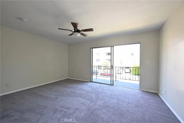 a view of a livingroom with an empty space and window