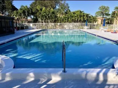 a view of a swimming pool with an outdoor seating