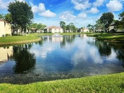 a view of a lake with a yard