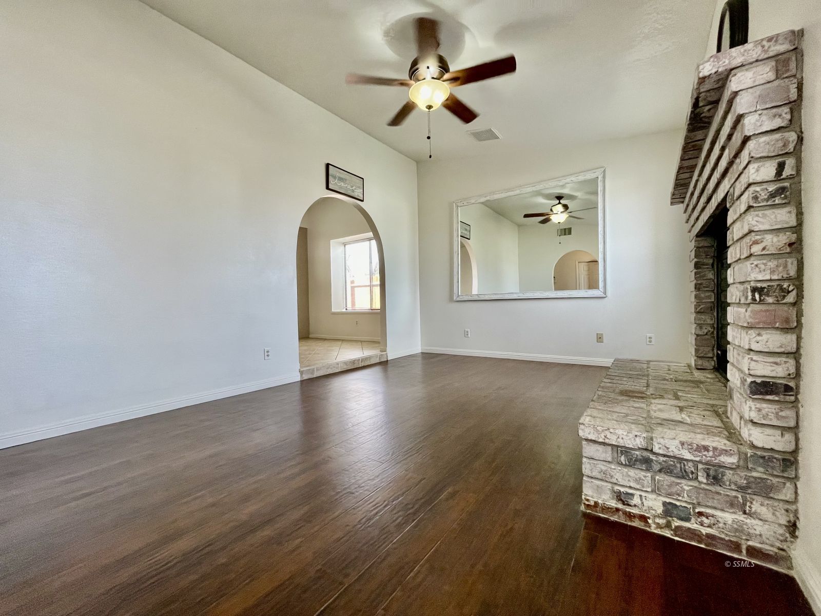 225 Michele Street Ridgecrest, CA 93555 - Photo 10 of 36 wooden floor in an empty room with a window
