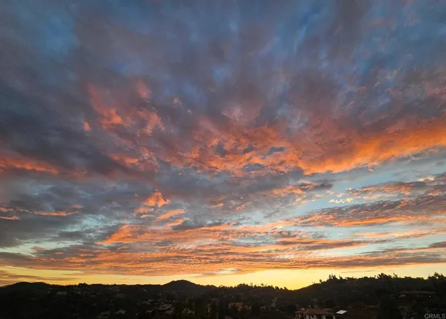 a sign on a wall next to a building